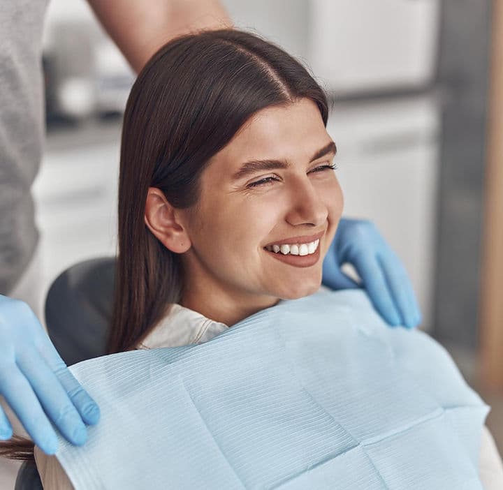 Smiling patient in the dental chair at Troy Meadows Dental in Lake Hiawatha, NJ